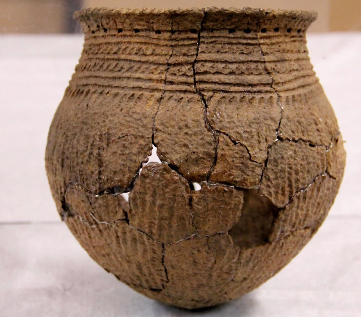 A piece of pottery, rebuilt shard-by-shard