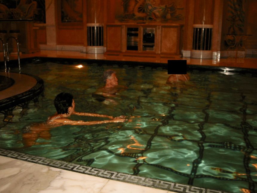 Bill Clinton, Ghislaine Maxwell and an unidentified person whose face has been redacted are seen in this undated photo released by the Justice Department as a part of the release of the Epstein Files, on Friday, December 19, 2025.