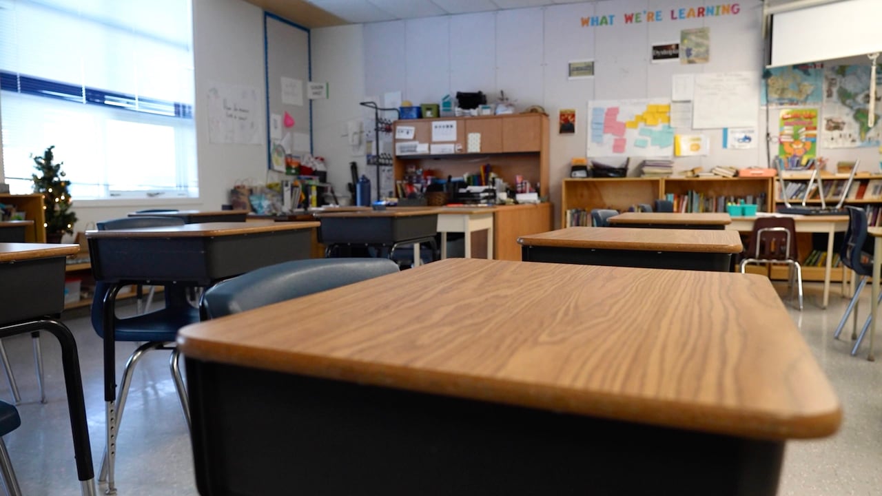 A few empty desks in a school classroom