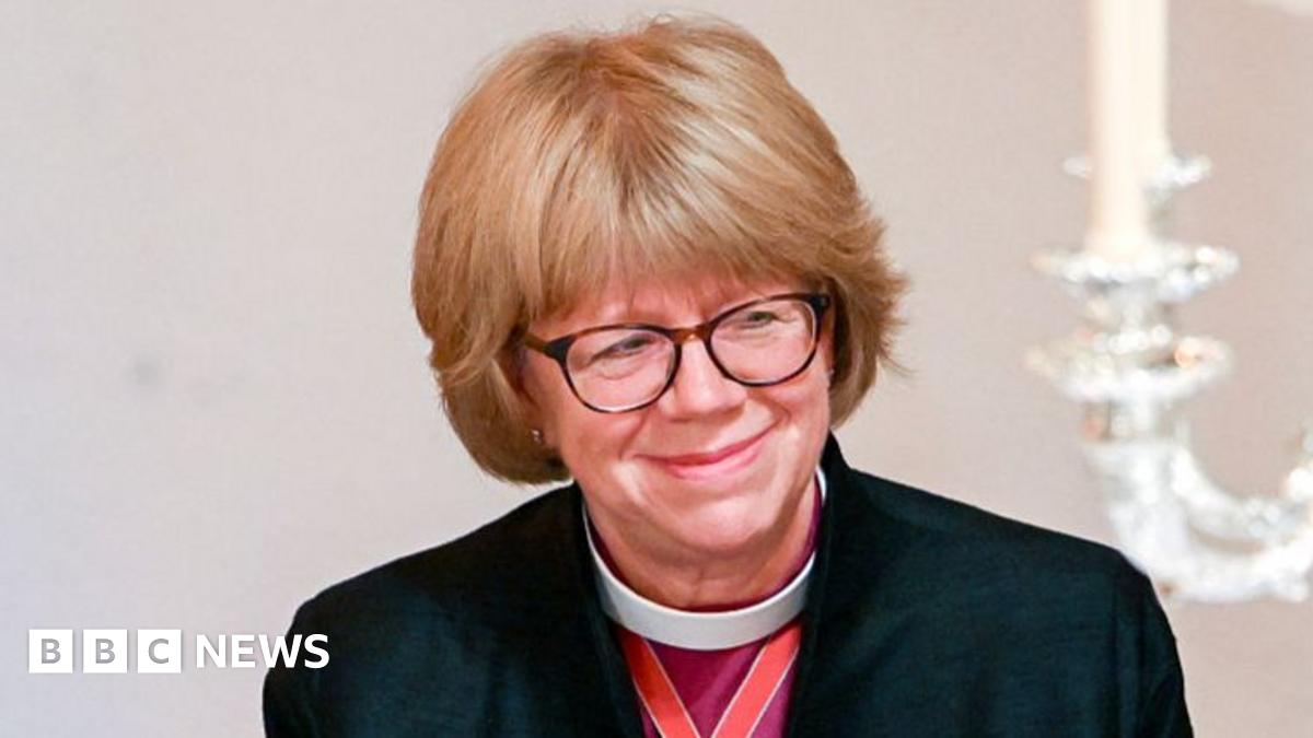 Sarah Mullally pictured smiling. She has short blonde hair and is wearing glasses.