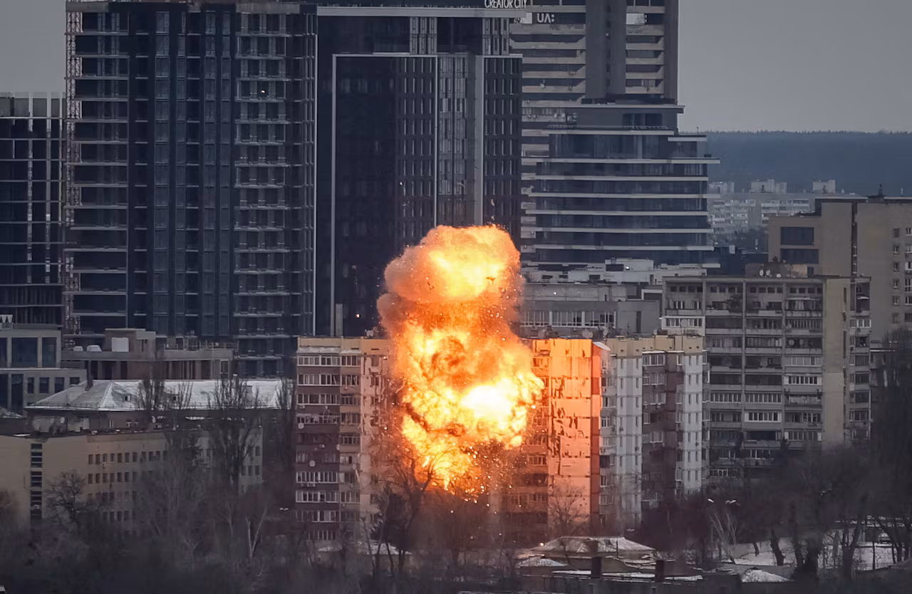 A fiery explosion is seen at an apartment building.