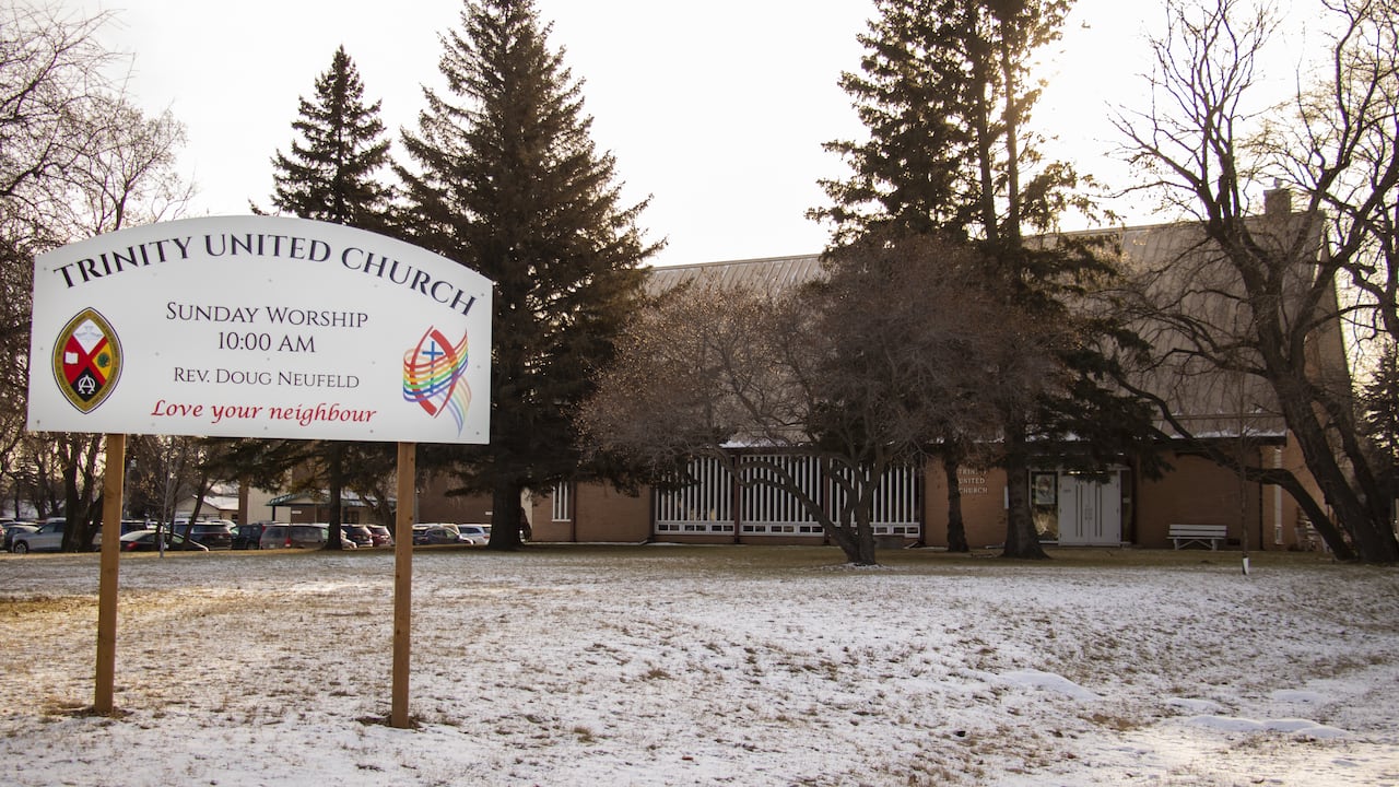 a church with a sign that says Trinity United church.