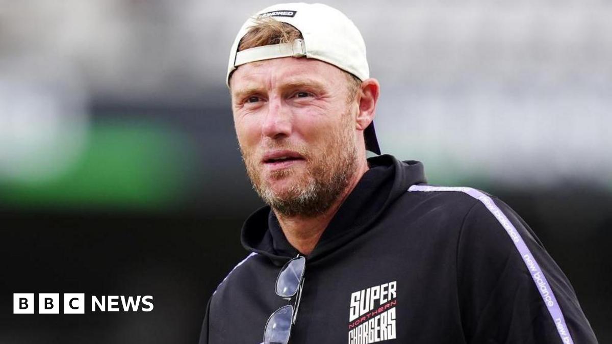 A man with short light brown hair and a beard is wearing a white baseball cap backwards and a dark blue jacket with 'Northern Super Chargers' written on it.