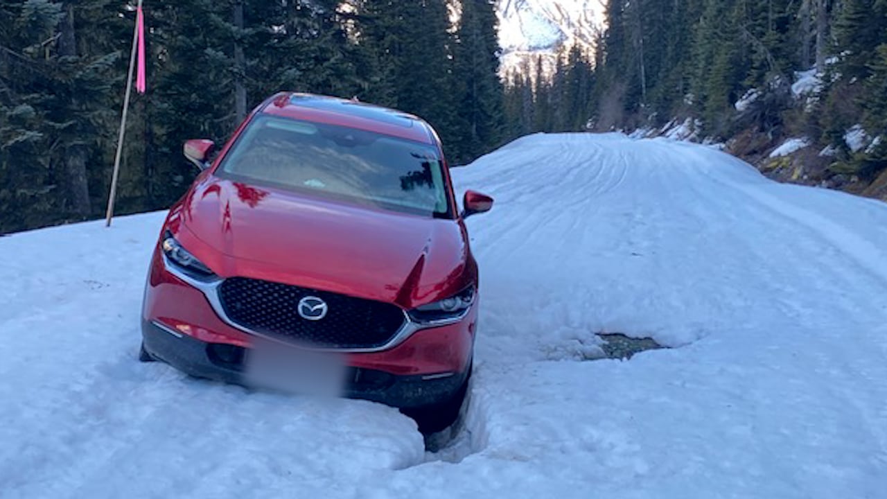 Vehicle stuck in snow on forest service road
