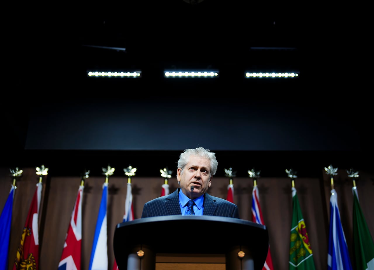 A man speaks at a podium