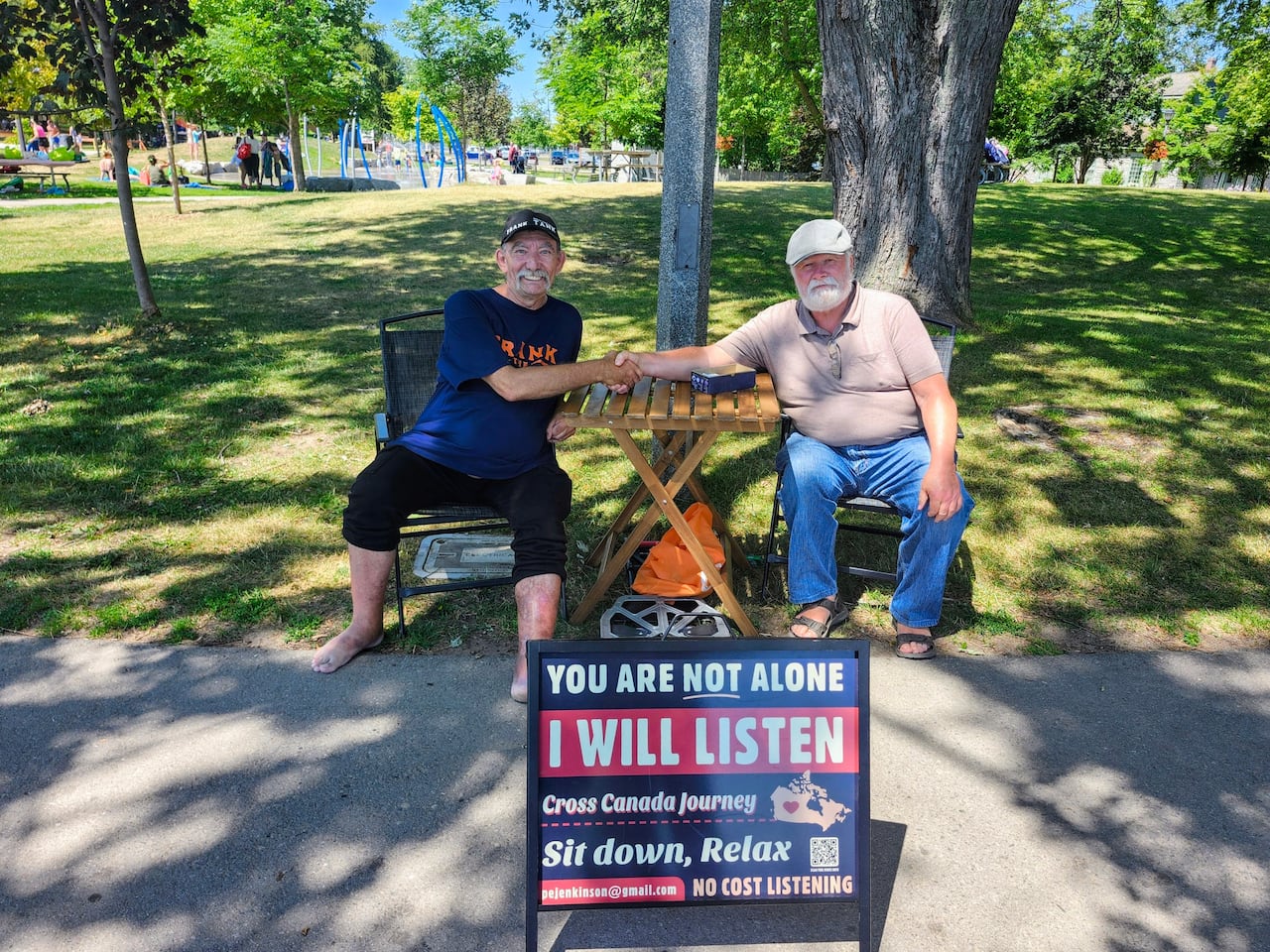 Paul Jenkinson, right, sits with Frank beachside in Oshawa, Ont. Jenkinson says Frank told him he survived multiple bouts of cancer, and that his current diagnosis seemed to be terminal, but he remains 'upbeat.'
