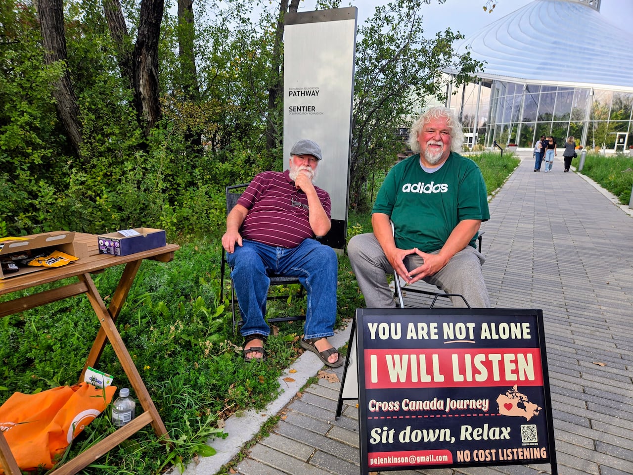 Paul Jenkinson, left and a retired police officer, right chat at The Leaf in Assiniboine Park where Jenkinson says he sat for 6 days.