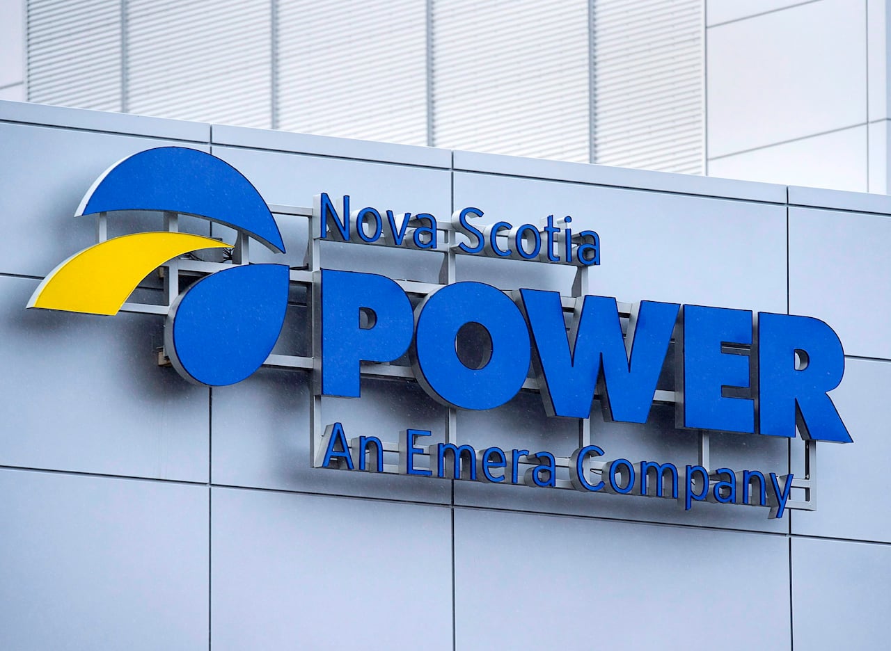 a sign on a gray building says "Nova Scotia Power an Emera Company." 