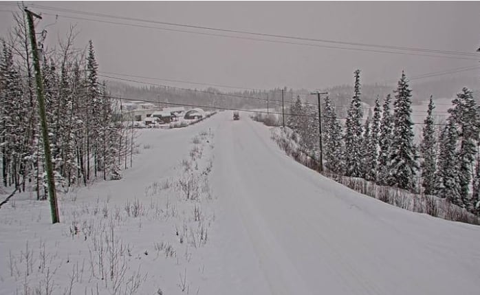 A stretch of highway that is completely snowed out.