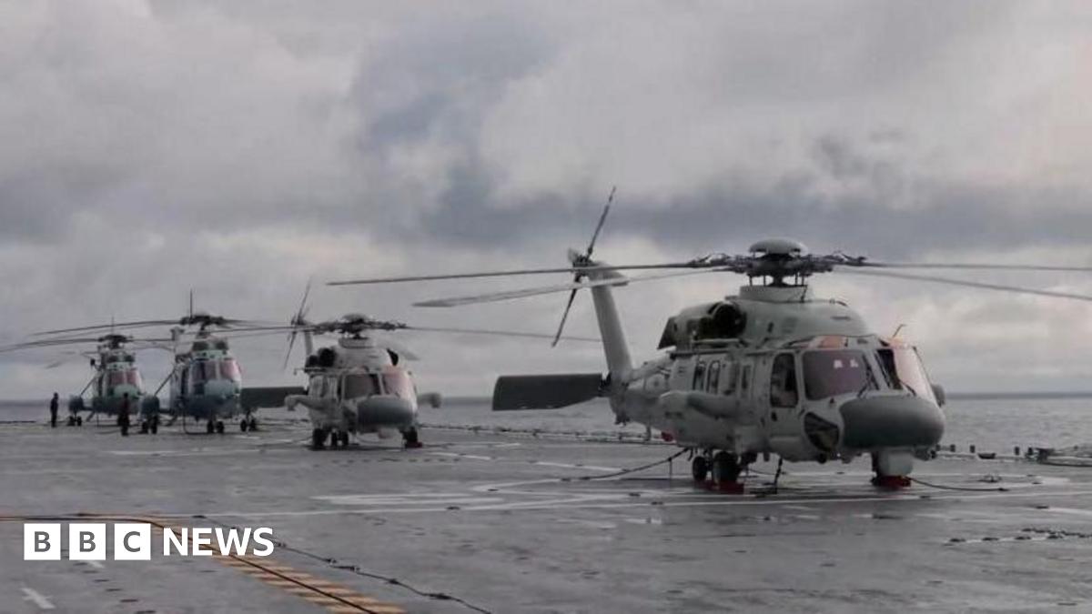 Helicopters on an amphibious assault ship take part in military drills in waters southeast of Taiwan, from a screenshot of a video released by the Chinese military's Eastern Theatre Command