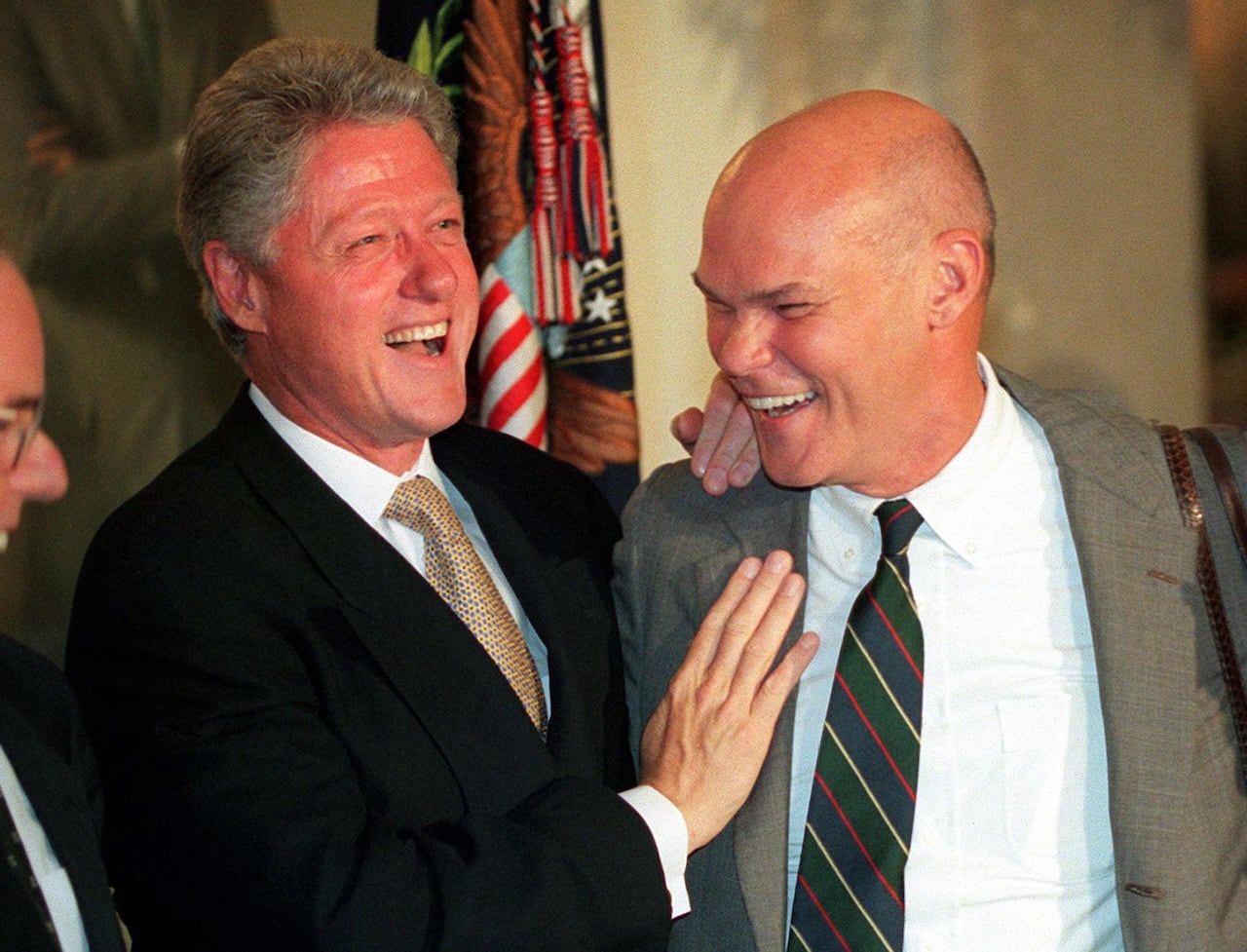 Former U.S. President Bill Clinton and friend James Carville laugh 18 July, 1999, during a working dinner at the White House in Washington, D.C.
