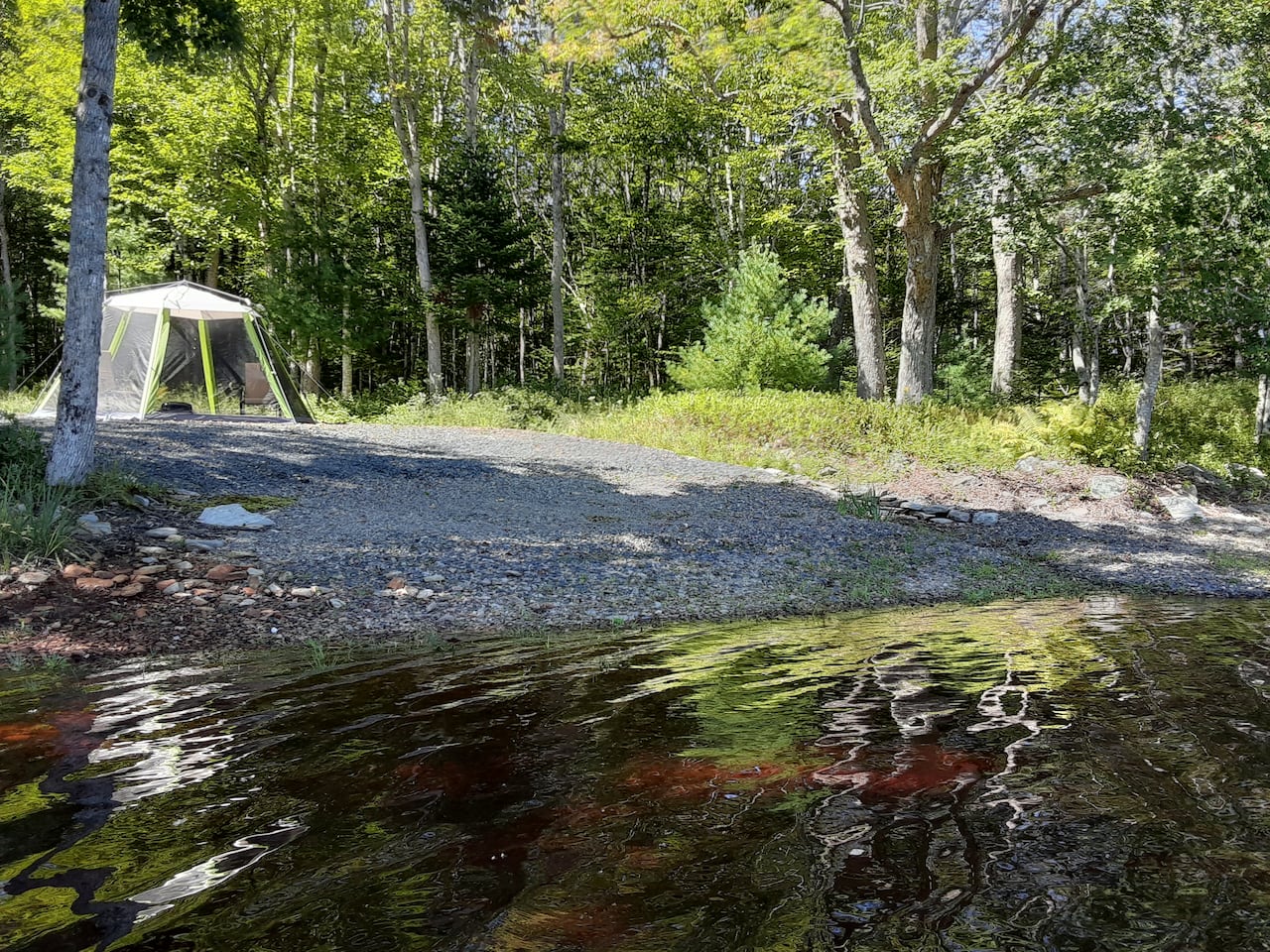 A gravel boat launch into a lake is shown.