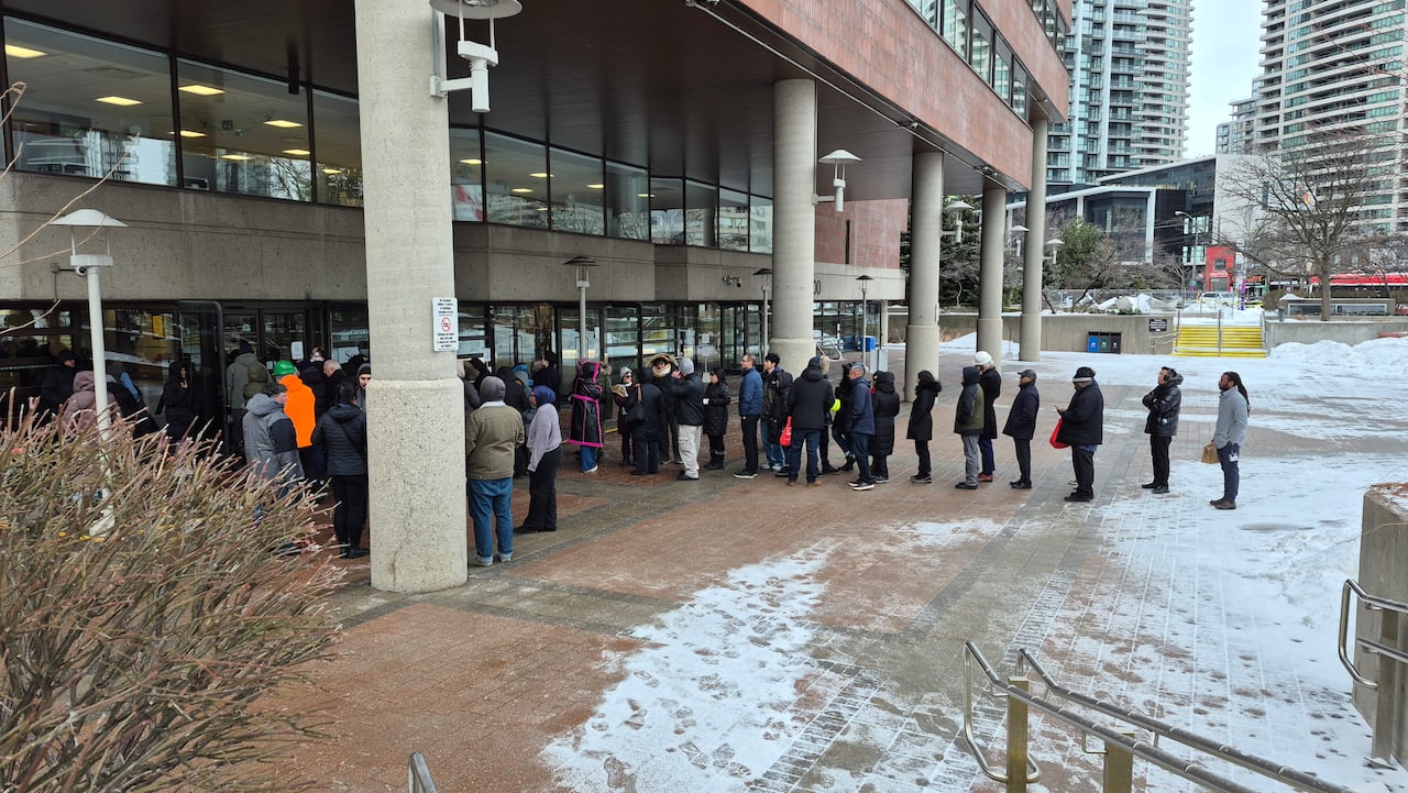 People lining up outside building 