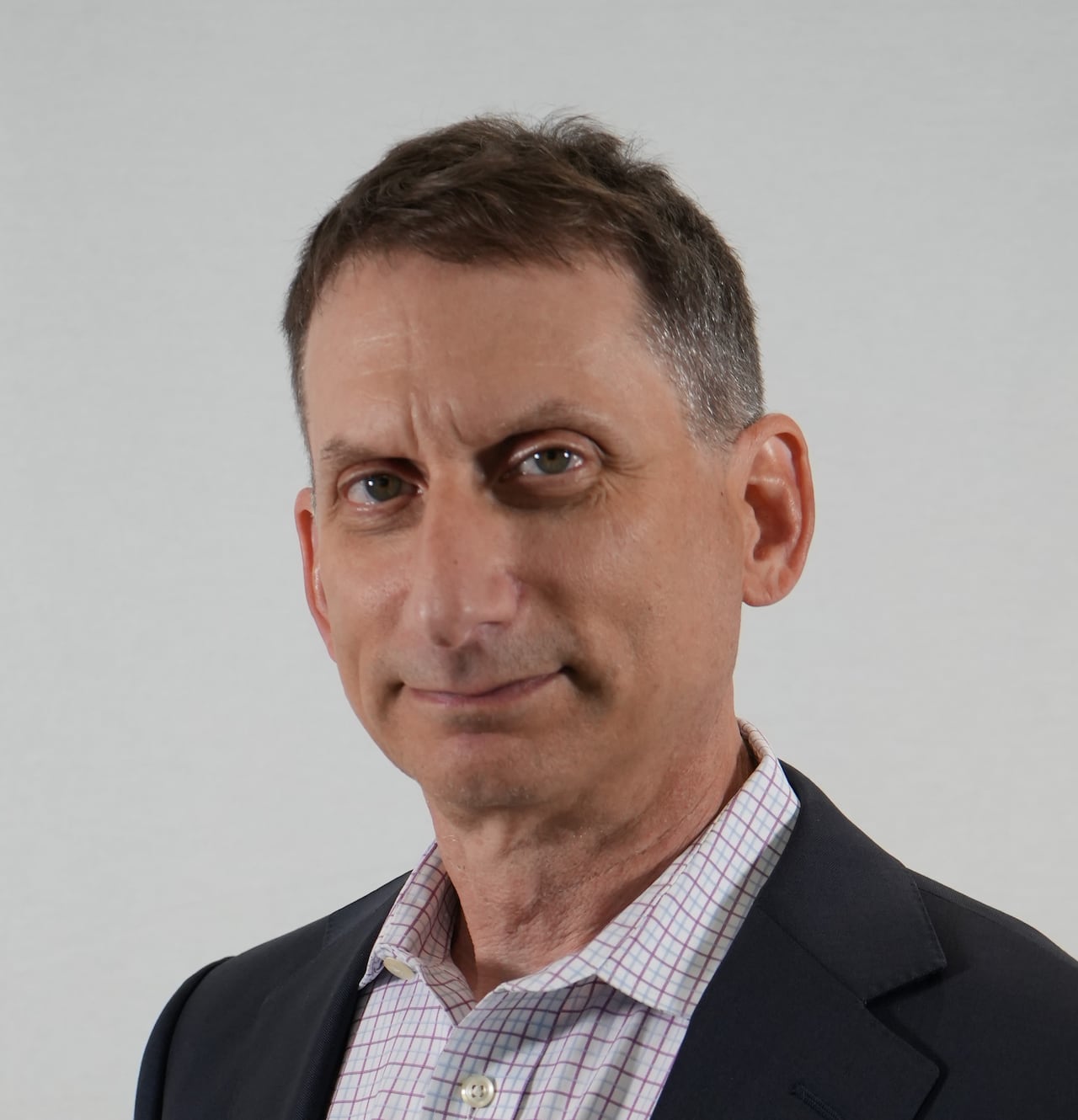Headshot of man in a suit