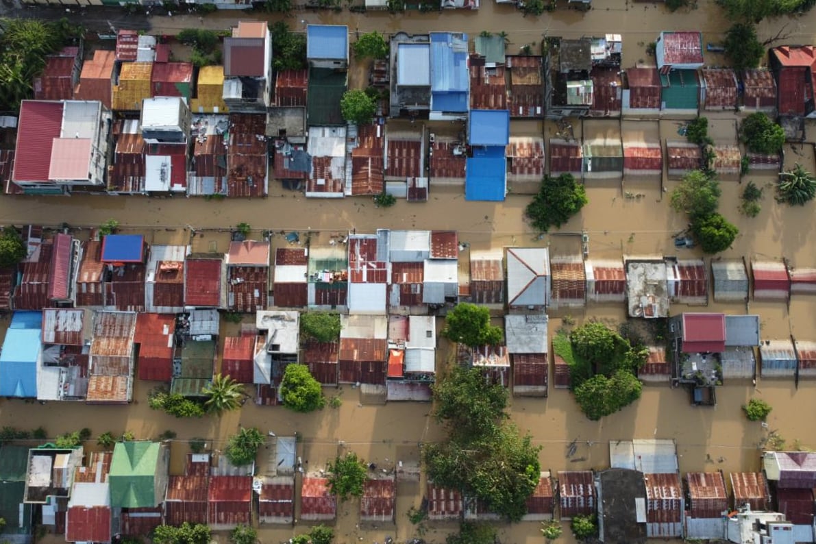 Houses are seen submerged in Ilagan, Isabela province, northern Philippines on Tuesday November 11. 2025 after the onslaught of Typhoon Fung-wong