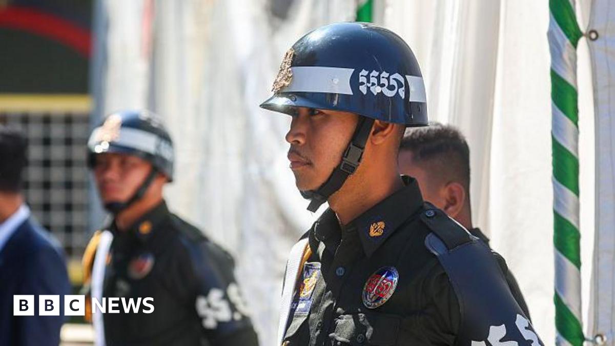 Cambodian military police officers stand guard