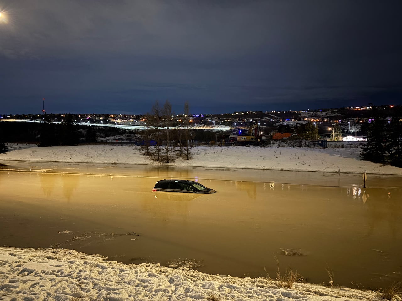 Flooding in Bowness after a water main break on Tuesday led several cars to be stuck and stranded in the water.