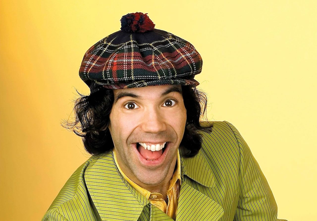 a guy in a tartan hat