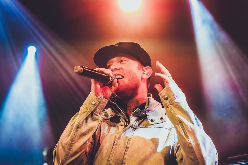 A man singing into a microphone