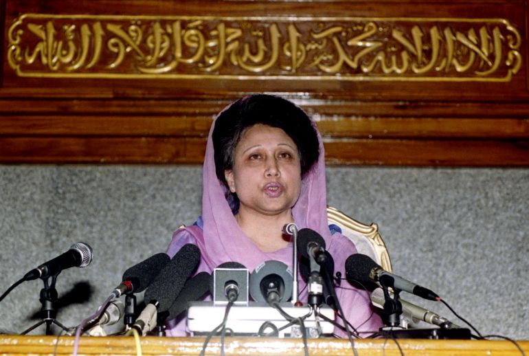 Bangladesh Prime Minister Begum Khaleda Zia speaks to reporters from below an Islamic inscription in Arabic reads "God is one and Mohamad is his prophet" February 13 in Dhaka. Khaleda Zia is pushing through with her plans to hold a general election on February 15 despite the withdrawal of all major opposition parties from the contest