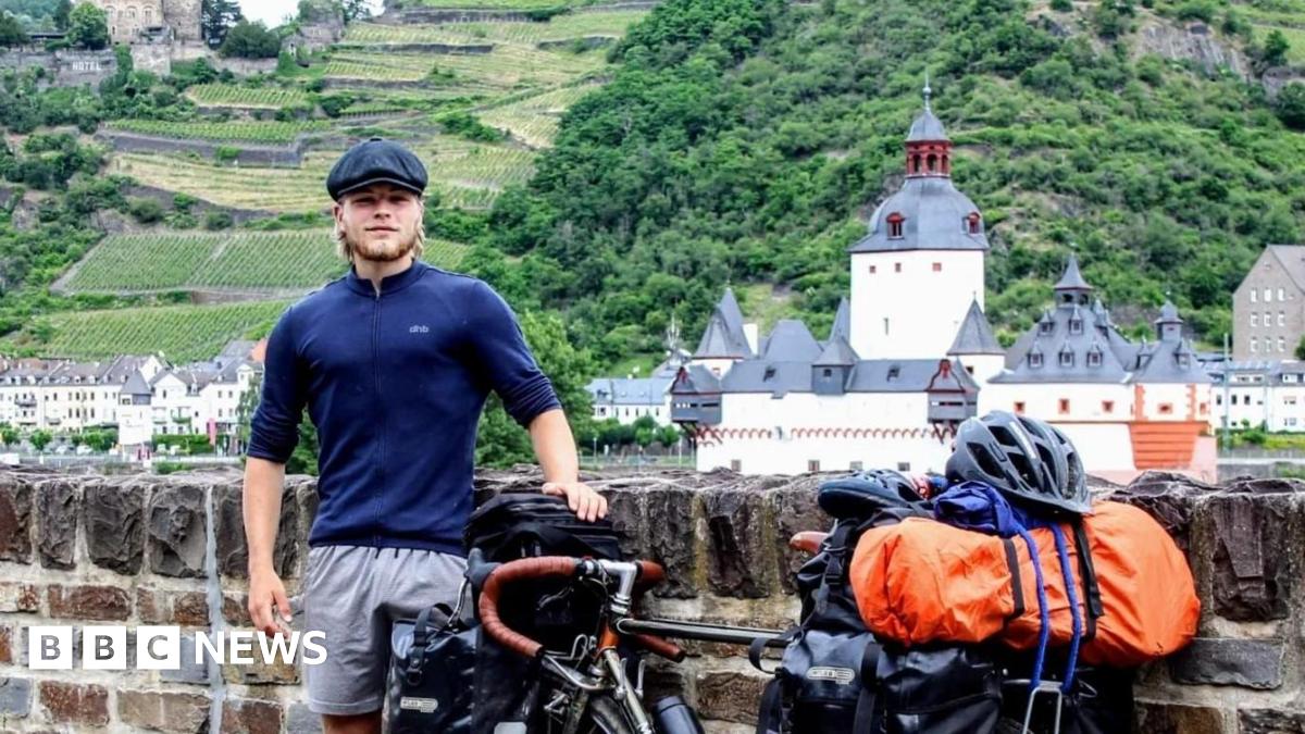 Jamie standing next to his bike.