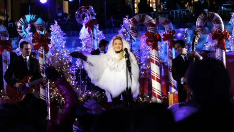 Getty Images Kylie Minogue in a festive outfit