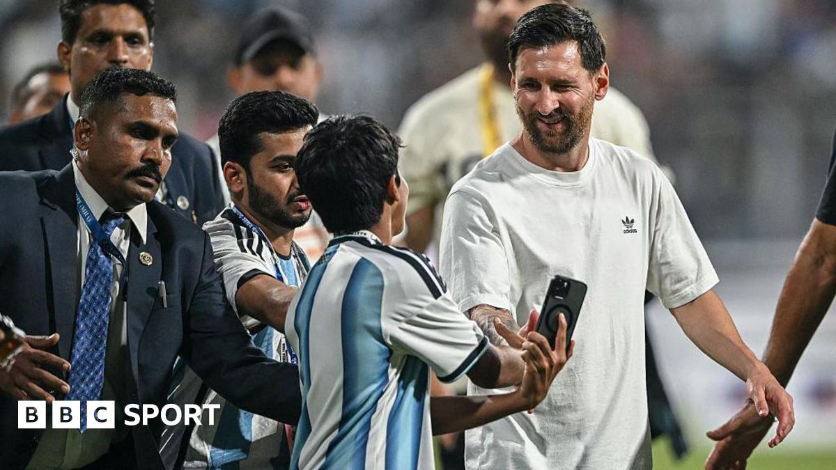 Lionel Messi meets with a young fan during his GOAT Tour at the Wankhede Stadium in Mumbai
