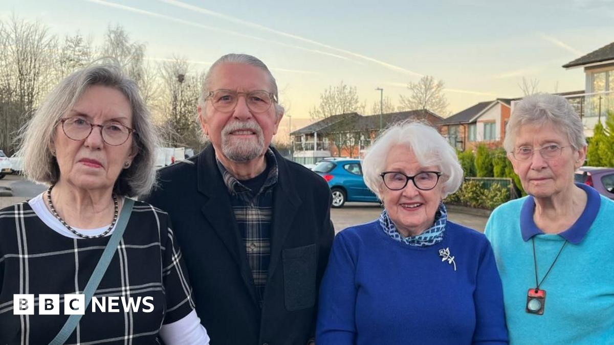 Residents of Lark Hill Retirement Village stood on the grounds of the village.