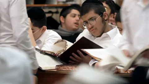 Nik Millard/BBC Ultra-Orthodox students at the the Kisse Rahamim yeshiva in Bnei Brak, Israel