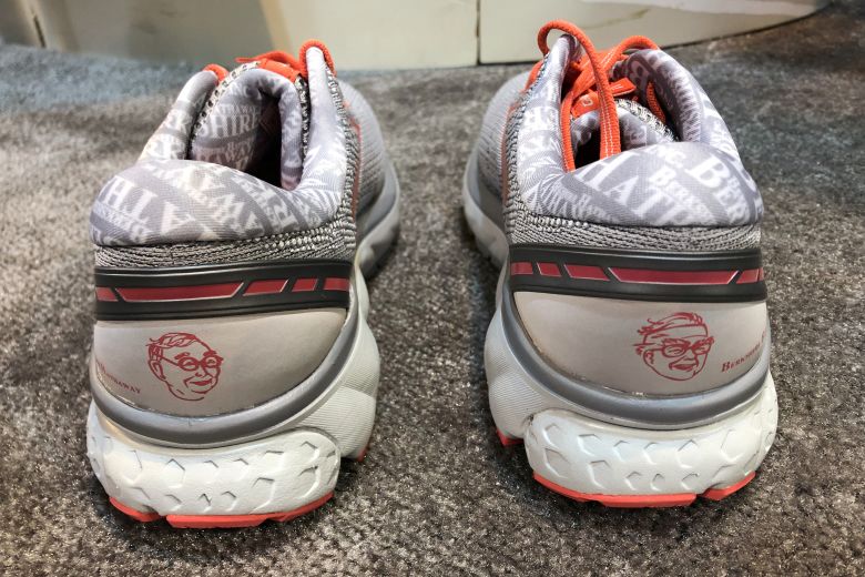 Special edition Brooks Ghost 11 running shoes featuring images of Berkshire Hathaway Chairman Warren Buffett and Vice Chairman Charlie Munger.