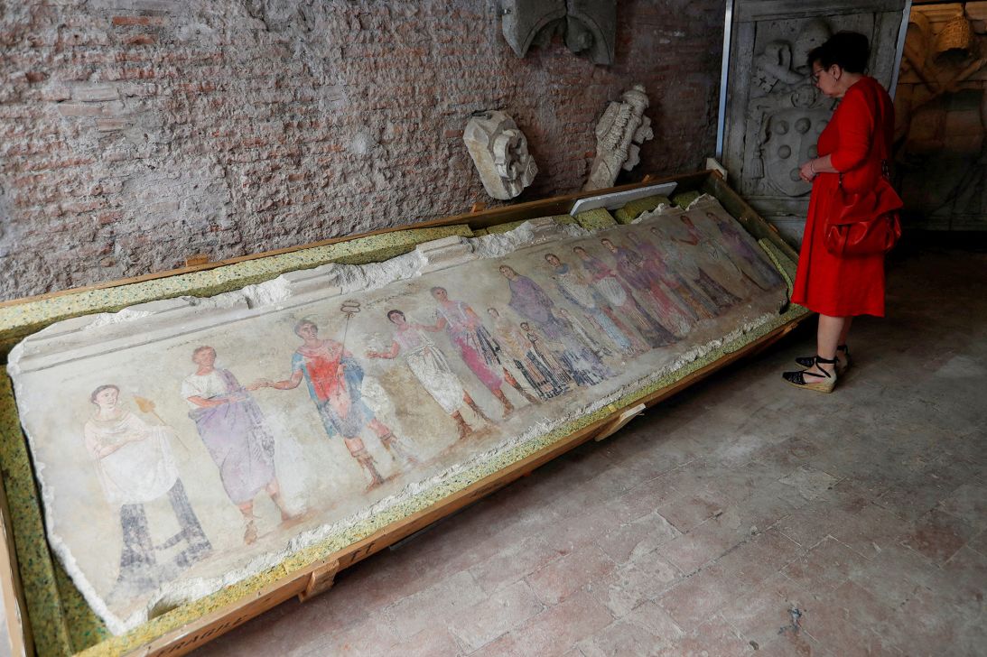 A painting on a marble slab, which was returned to Italy from London, is seen on display at Castel Sant'Angelo in Rome in 2023. It was among 750 looted treasures seized from the notorious British antiquities trader Robin Symes, whose archive Tsirogiannis also has access to.