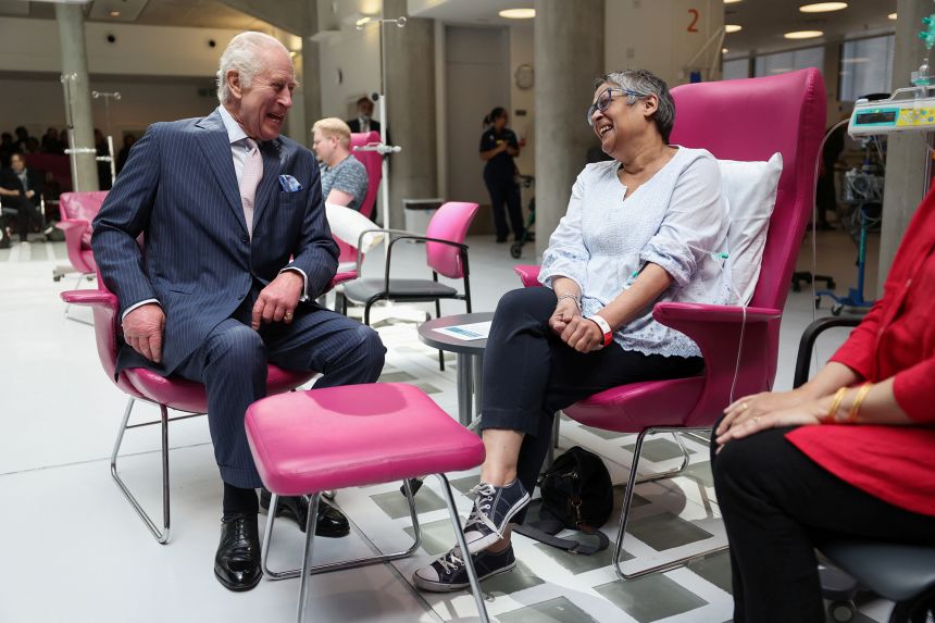 King Charles meets with patient Asha Millan during a visit to the University College Hospital Macmillan Cancer Centre in London in April 2024.