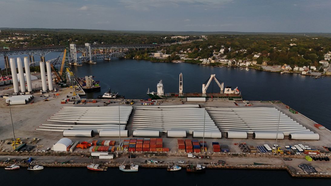 Wind turbine parts for Revolution Wind, one of the now-stalled offshore wind projects in New England, are staged on a pier in New London, Connecticut, in September.