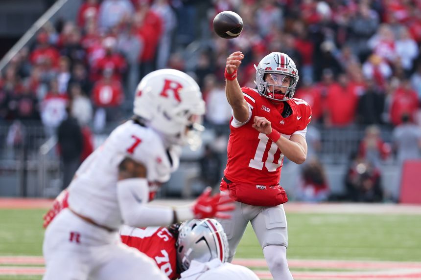 Ohio State Buckeyes quarterback Julian Sayin throws pass against Rutgers Scarlet Knights.