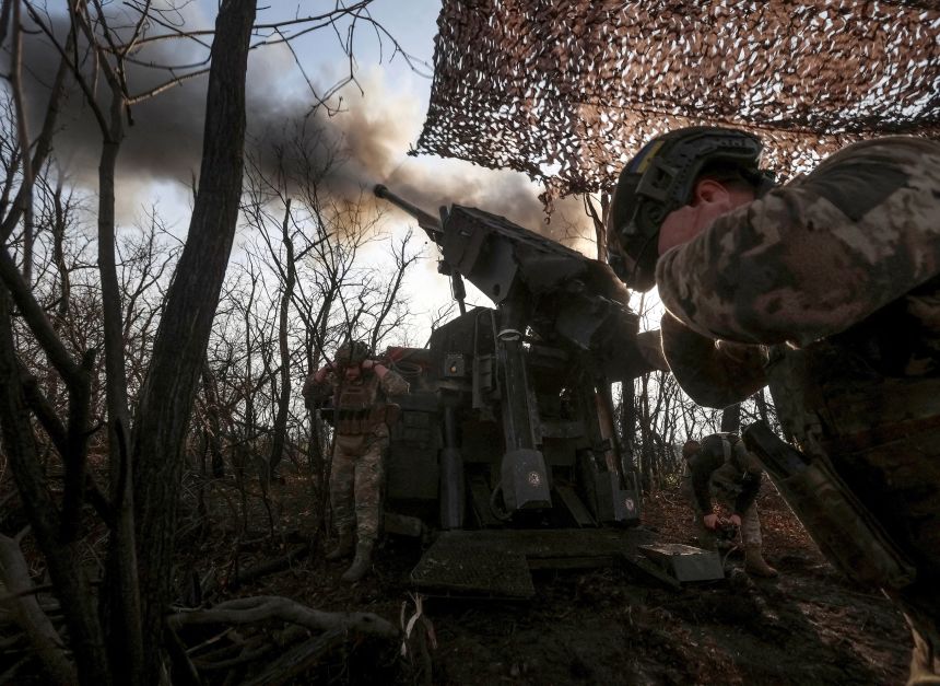 Ukrainian servicemen fire a howitzer towards Russian troops at a position on the front line, near the frontline town of Pokrovsk, Donetsk, on November 23, 2025.