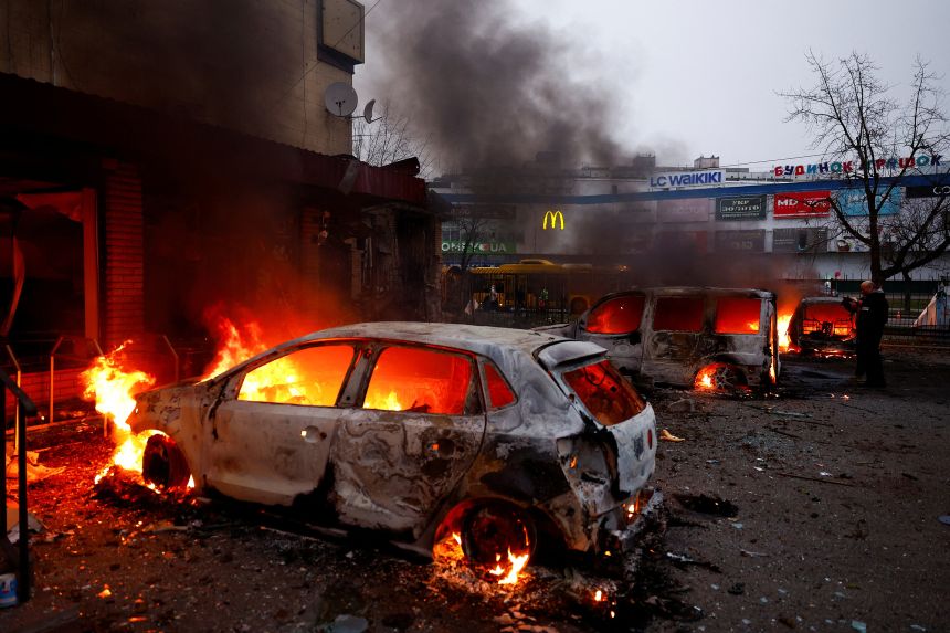 Vehicles burn after being damaged during a Russian missile and drone attack on Kyiv on November 29, 2025.