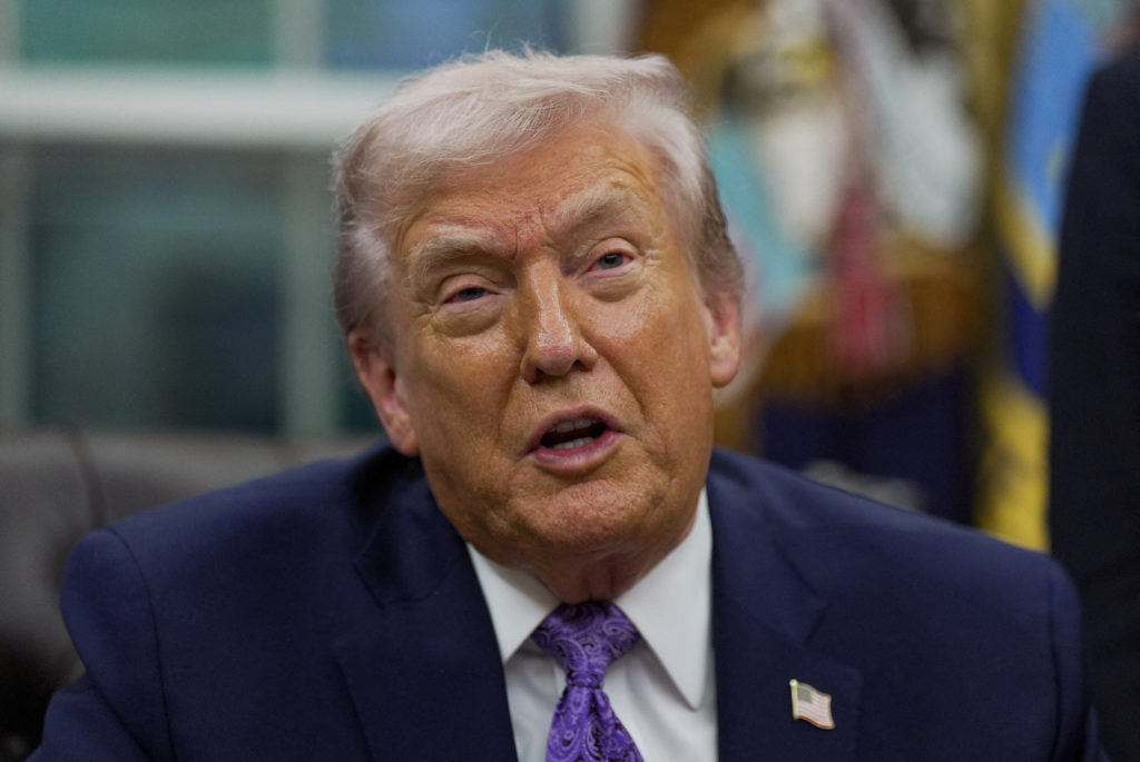 FILE PHOTO: U.S. President Donald Trump signs an executive order in the Oval Office of the White House