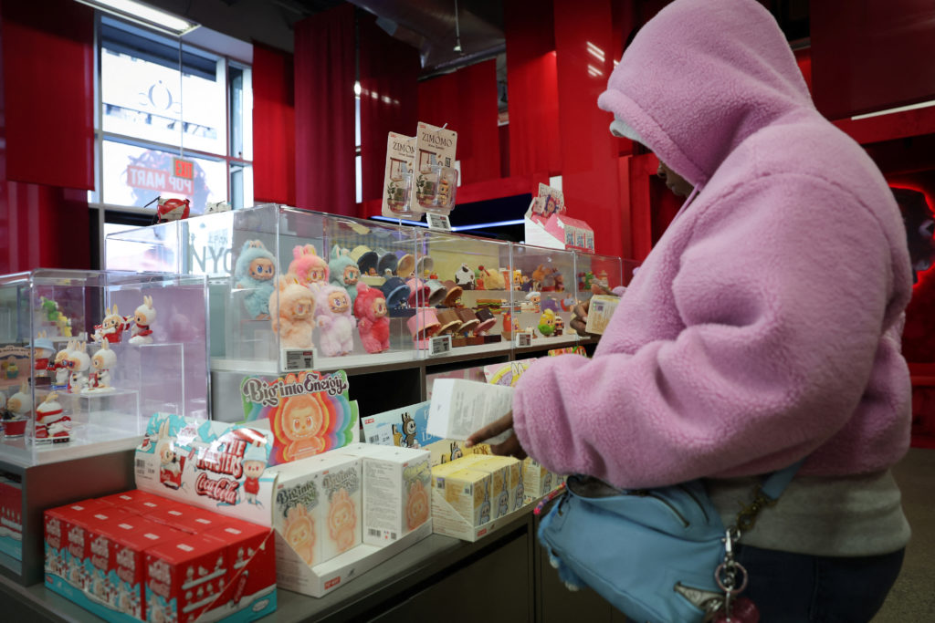 Consumers shop for Labubus and other art toys at Pop Mart's Skullpanda pop-up shop in Manhattan, in New York City
