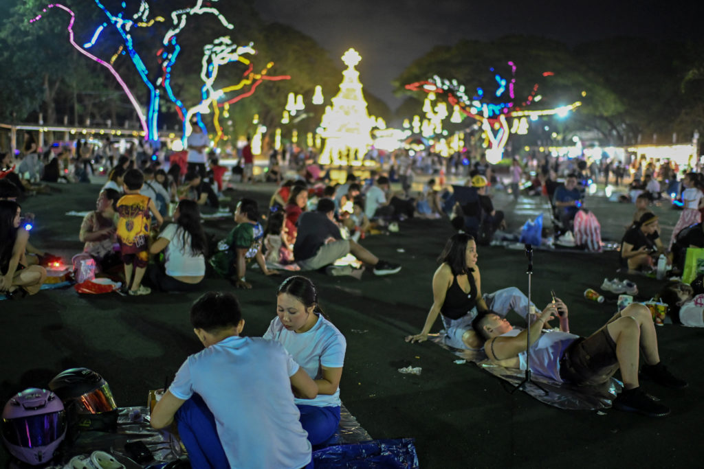 People gather to celebrate Christmas at the Quezon Memorial Circle, in Quezon City