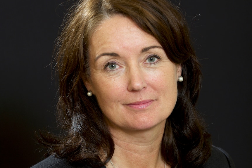 A woman poses for a headshot