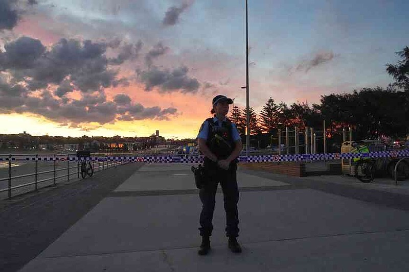 Police cordon off an area at Bondi Beach after a reported shooting in Sydney, Sunday, Dec. 14, 2025. (AP Photo/Mark Baker)