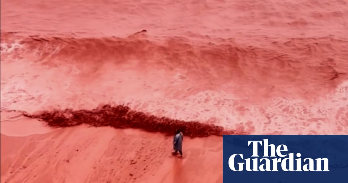 Rainfall creates crimson spectacle at beach on Iran’s Hormuz Island | Iran
