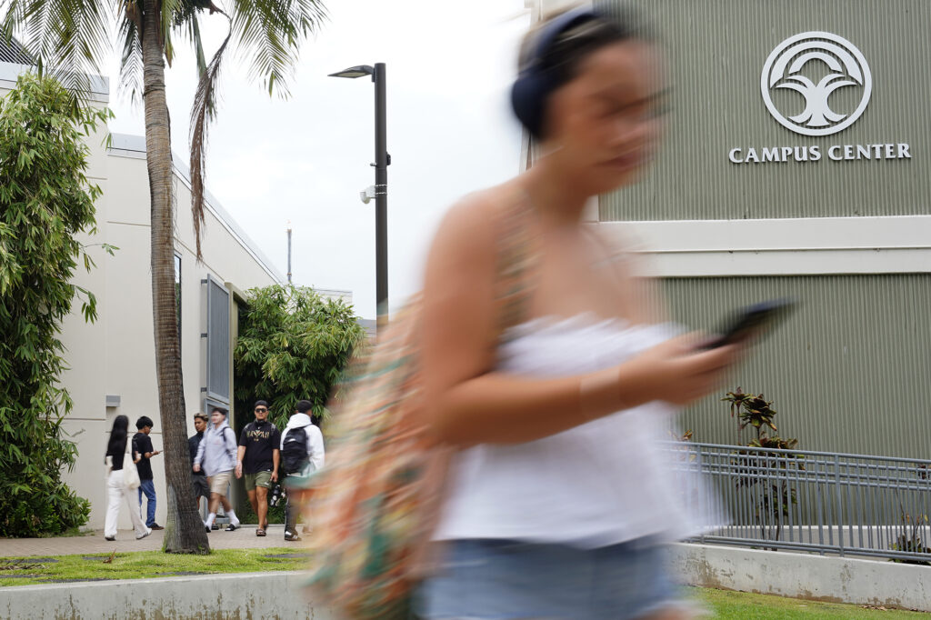 Students return to the University of Hawaii Manoa for the first day of classes Monday, Aug. 26, 2024, in Honolulu. The blur is a result of using a slow shutter speed of 1/20th of a second. (Kevin Fujii/Civil Beat/2024)