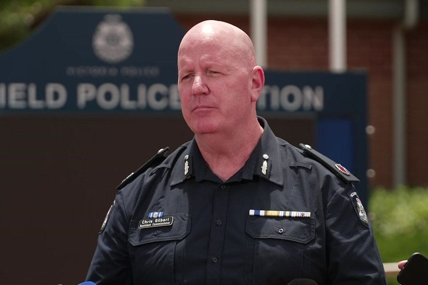 Police officer Chris Gilbert stands outside the Caulfield police station.