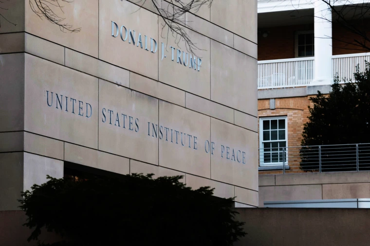President Donald Trump's name is seen recently placed on the outside of the U.S. Institute of Peace headquarters on Dec. 3, 2025 in Washington, D.C.