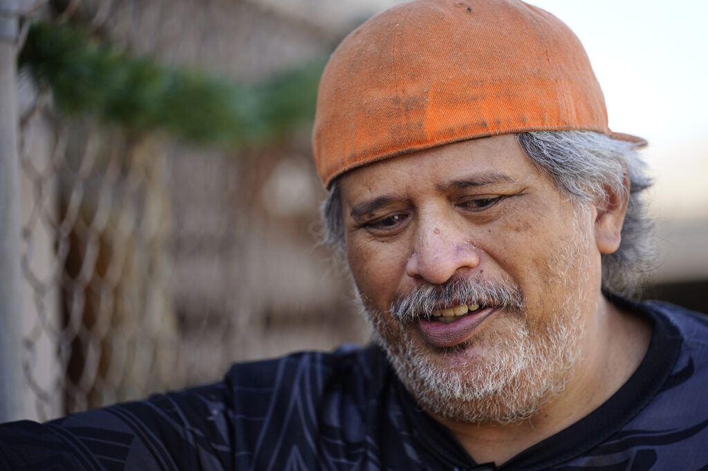 Jack Kaauwai, a neighbor and witness to the deadly New Years Eve fireworks explosion in Salt Lake/Āliamanu, is photographed outside his home Thursday, Dec. 4, 2025, in Honolulu. (Kevin Fujii/Civil Beat/2025)