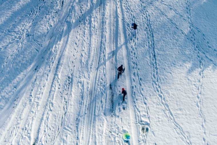 People play in the snow.