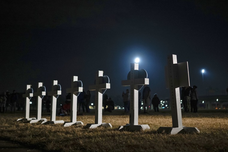 Crosses stand during a vigil on Nov. 7, 2025, for those killed and missing after a UPS plane crashed  in Louisville, Ky. 