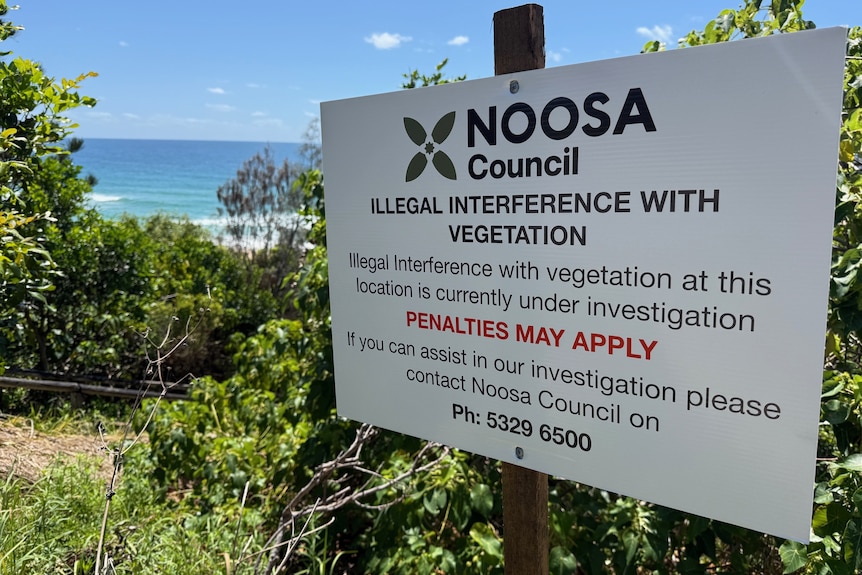 Sign noting illegal interference with vegetation
