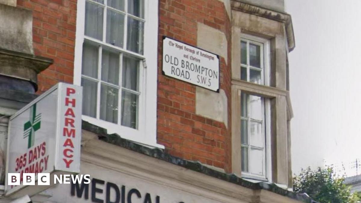 A general view of a street sign attached to a building. It reads: Old Brompton Road.